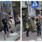 В Киеве девушка в нижнем белье устроила танцы на дорожном знаке перед полицейскими. Видео