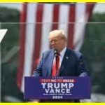 Trump spoke behind bulletproof glass