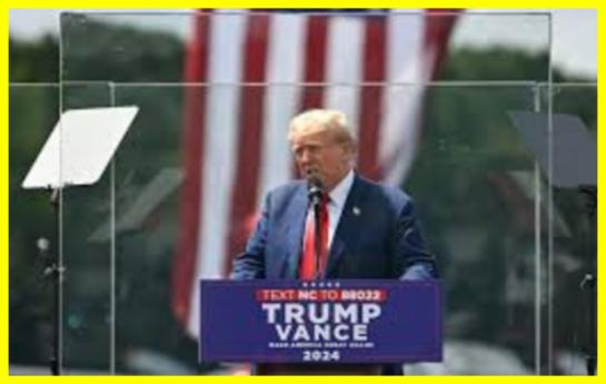 Trump spoke behind bulletproof glass