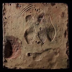 Ancient tile with footprints left for ages