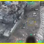 A Russian tank became entangled in barbed wire and stalled