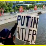 An activist with a Putin — Hitler poster was detained in Moscow