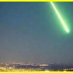 A ball of green fire flew over the city