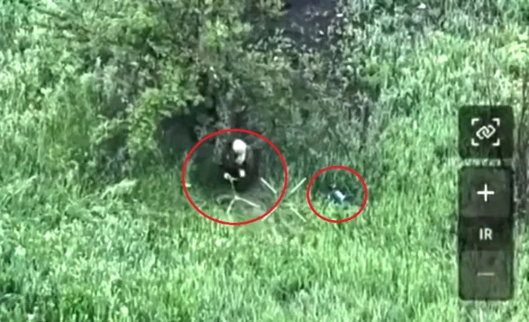 Russian Soldier Tries to Destroy a Drone with a Stick