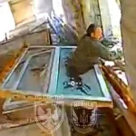 Russian Soldier Gets Stuck in Window Escaping Ukrainian Drone