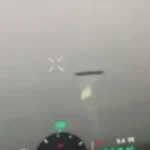 Ukrainian servicemen videotape a disk-shaped UFO