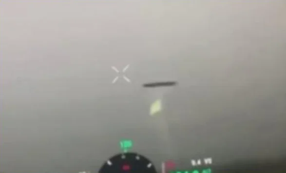 Ukrainian servicemen videotape a disk-shaped UFO